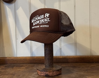 Salvage and Sawdust Vintage Supply Trucker Cap. Size O/S, Brown/White.