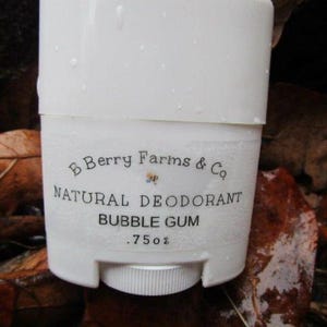 May include: White deodorant stick with a black label that reads "B Berry Farms & Co. Natural Deodorant Bubble Gum .75 oz".
