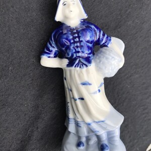 Antique porcelain Dutch girl figurine.