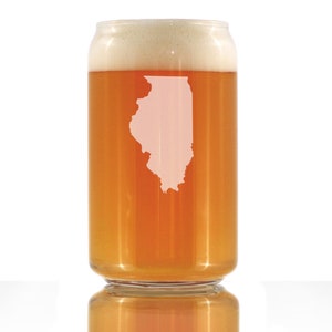 May include: A clear glass can with a white outline of the state of Illinois on the side. The can is filled with a light amber colored liquid and has a white foam head.