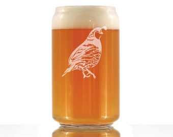 May include: A clear glass can with a frosted design of a quail. The can is filled with a light amber colored beverage and has a white foam head.