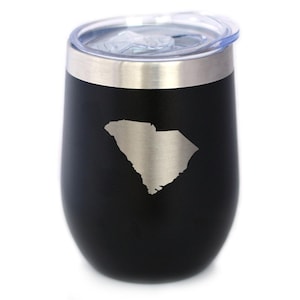 May include: A black insulated tumbler with a silver rim and a clear lid. The tumbler features a silver outline of the state of South Carolina. The stemless wine glass design is ideal for hot or cold beverages.
