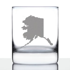 May include: A clear glass tumbler with an etched outline of the state of Alaska. The glass is perfect for enjoying your favorite beverage.