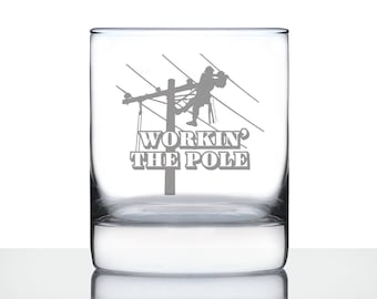 May include: A clear glass tumbler with a silhouette of a worker on a power line and the text "Workin' the Pole".