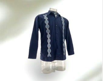 May include: A navy blue long-sleeved shirt with a white and light blue embroidered design on the front.