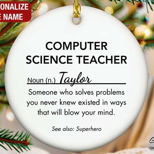 May include: A white ceramic Christmas ornament with gold trim, featuring the text "COMPUTER SCIENCE TEACHER" and a personalized name. The ornament includes a definition and the phrase "See also: Superhero."