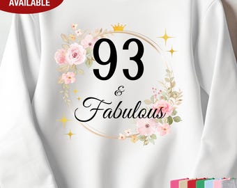 May include: White sweatshirt with a floral wreath design and the text "93 & Fabulous" in black.
