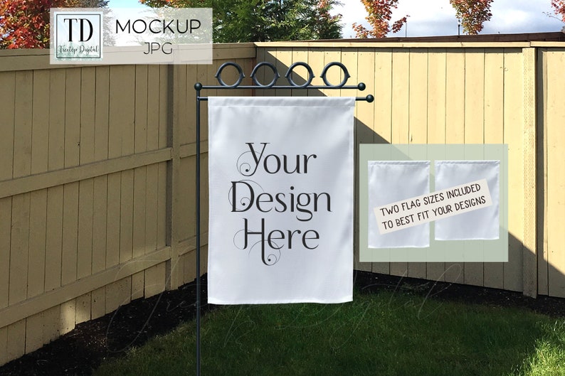 May include: White garden flag with the text "Your Design Here" in black script. The flag is displayed on a black metal stand in a grassy yard. Two additional white flags are shown with text.