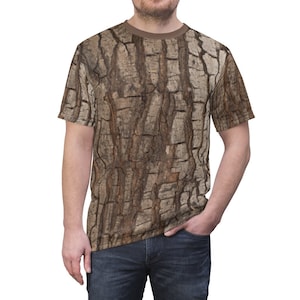 May include: A brown and beige short-sleeved t-shirt with a tree bark pattern.