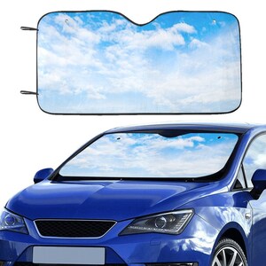 May include: A blue car windshield sunshade with a sky and clouds design. The sunshade is made of a lightweight material and is easy to install. It helps to keep the car cool and protect the interior from the sun's harmful rays.