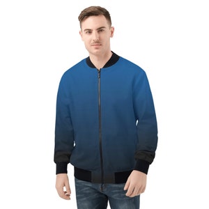 May include: A blue and black bomber jacket with a zipper closure. The jacket has a gradient design, fading from dark blue to black.
