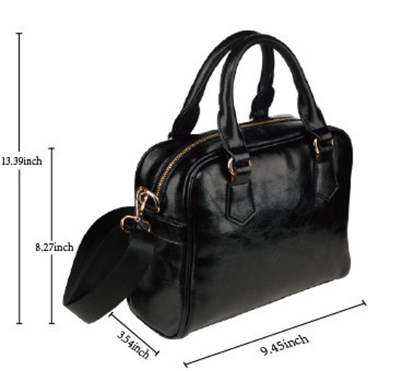 May include: Black leather satchel handbag with a top handle and a detachable shoulder strap. The bag measures 24 cm wide, 34 cm tall, and 21 cm deep.