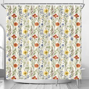 May include: A white shower curtain with a floral pattern featuring yellow, red, and blue flowers. The flowers are arranged in a repeating pattern on a white background.