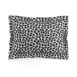 May include: A white pillowcase with a black and gray leopard print pattern.