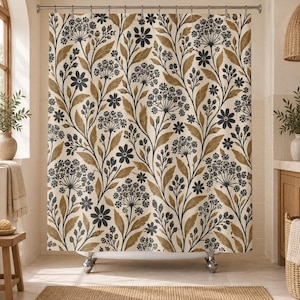 May include: A shower curtain featuring a repeating botanical pattern of dark charcoal flowers and golden-brown leaves on a cream-colored background. The design includes various floral clusters, stems, and foliage arranged in a vertical layout.