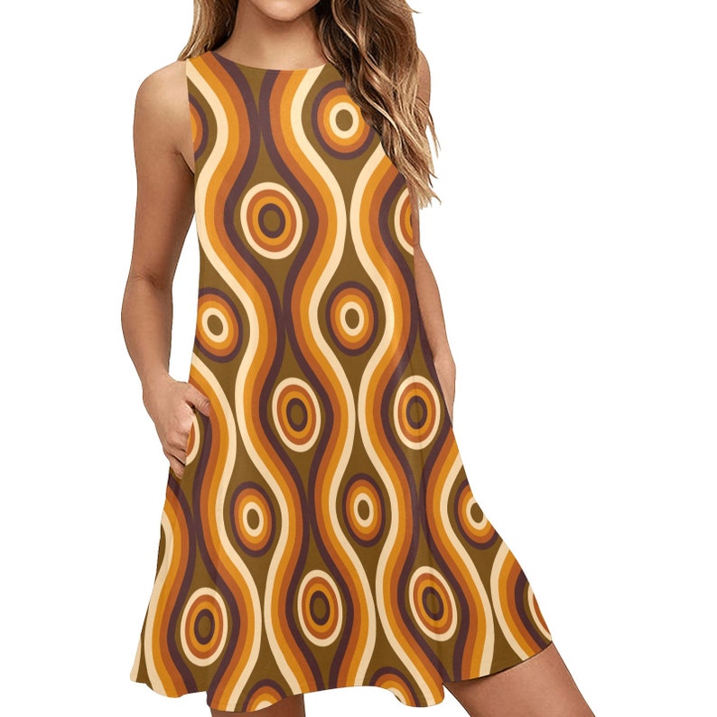 May include: A sleeveless, brown, orange, and white dress with a retro, wavy, and circular pattern. The dress has a loose fit and a slightly flared skirt.