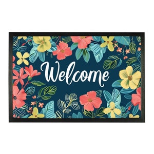 May include: A welcome mat with a blue background and a floral pattern. The mat has the word "Welcome" in white lettering.
