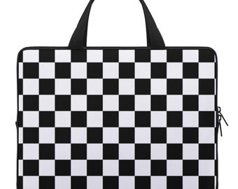 May include: Black and white checkered laptop case with a black handle.
