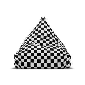 May include: A black and white checkered bean bag chair. The chair is shaped like a pyramid and is made of a soft, comfortable fabric.