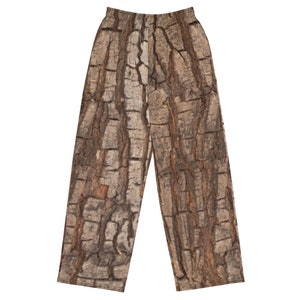 May include: Brown and tan pajama pants with a tree bark pattern.