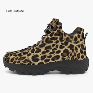 May include: A pair of brown and black leopard print hiking boots with a black rubber sole.