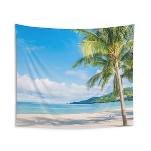 May include: A tapestry featuring a vibrant blue sky with fluffy white clouds, a calm turquoise ocean, and a lush green palm tree on a white sandy beach.