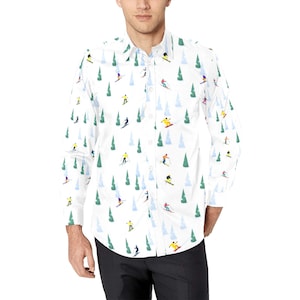 May include: A white long-sleeved button-down shirt with a repeating pattern of skiers and pine trees.