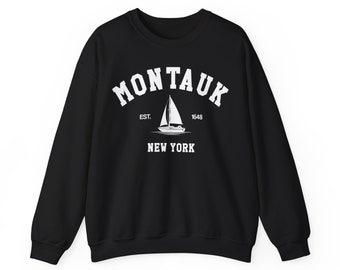 May include: Black sweatshirt with white text that reads "Montauk Est. 1648 New York" and a sailboat graphic.