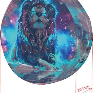 May include: A round, 32 inch diameter, 10 inch thick, blue and purple galaxy print with a black lion in the center. The lion has a blue mane and a white background.