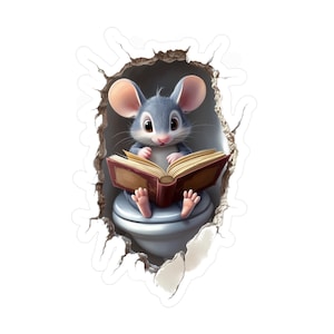 May include: A cute gray mouse sits on a toilet and reads a book. The mouse is peeking out of a hole in a white wall.