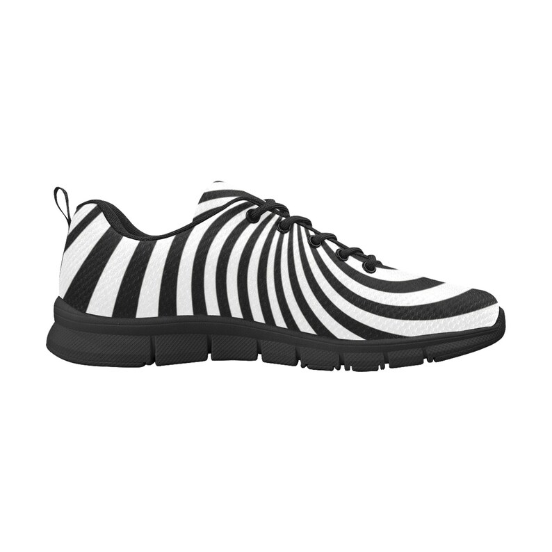 May include: Black and white striped athletic shoes with a spiral pattern. The shoes have a black sole and a white upper.