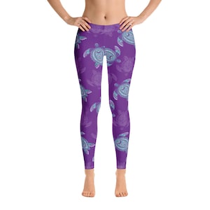 May include: Purple leggings with a repeating pattern of detailed sea turtles in shades of blue and white. The leggings are form-fitting and made of a stretchy material.