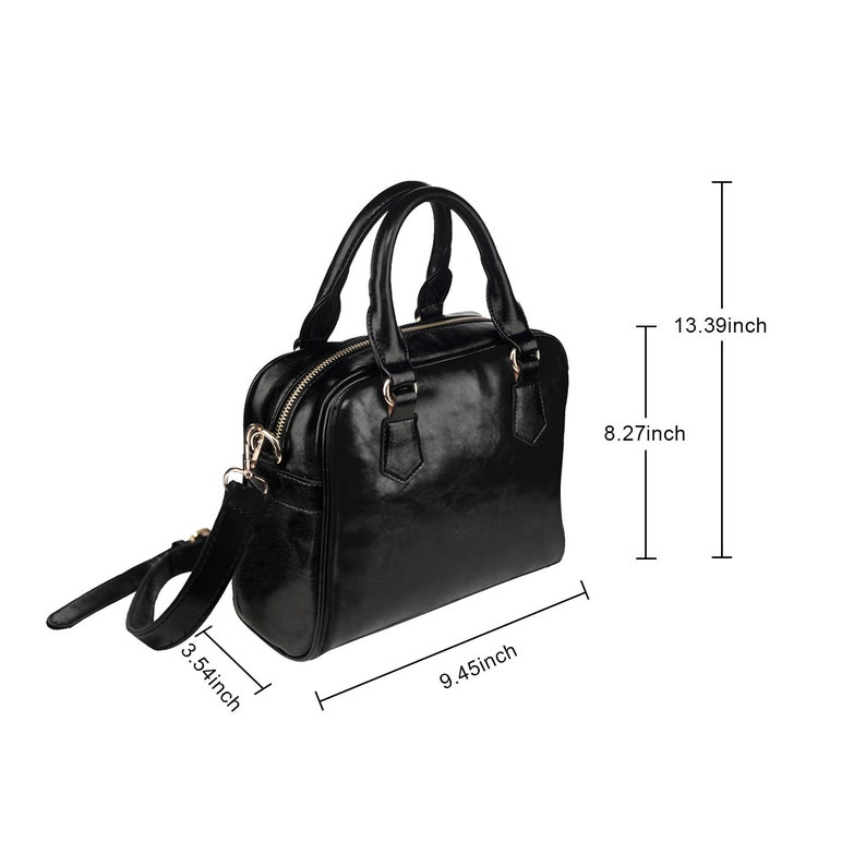 May include: A black leather satchel handbag with a gold zip and hardware. The bag has a top handle and a detachable shoulder strap. The bag measures 9.45 inches wide, 8.27 inches tall, and 3.54 inches deep.