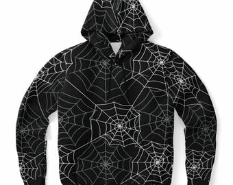 May include: Black hooded sweatshirt featuring a repeating pattern of white and gray spiderwebs. The design covers the entire garment, including the hood and sleeves. The sweatshirt has a drawstring at the neckline and a kangaroo pocket.