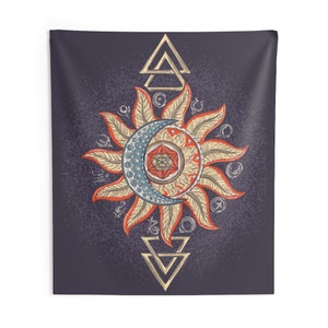 May include: A tapestry featuring a sun and moon design with a geometric pattern in the center. The sun and moon are surrounded by a circle of symbols and the design is framed by two triangles.