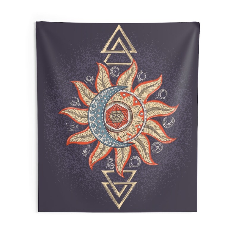 May include: A tapestry featuring a sun and moon design with a geometric pattern in the center. The sun and moon are surrounded by a circle of symbols and the design is framed by two triangles.
