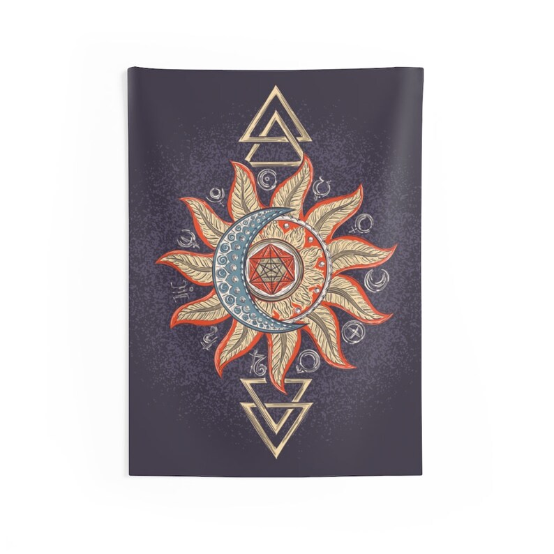 May include: A tapestry featuring a stylized sun and moon with a geometric design in the center. The sun and moon are surrounded by various symbols and the design is framed by two triangles.