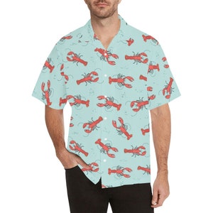 May include: A light blue short-sleeved button-down shirt with a red lobster print.
