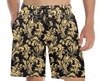 May include: Black swim trunks with a gold floral pattern.