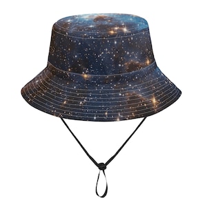 May include: A bucket hat featuring a vibrant galaxy print in shades of blue, gold, and white. The hat has a wide brim and a black adjustable chin strap. This hat is a stylish accessory for outdoor activities.
