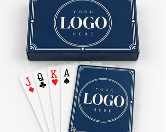 May include: A dark blue rectangular deck box and a set of playing cards featuring a white circular emblem with the text YOUR LOGO HERE. The cards display a Jack of diamonds, Queen of clubs, King of hearts, and Ace of spades in a fanned arrangement.