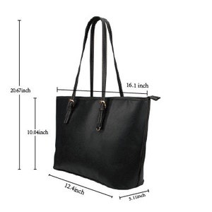 May include: Black tote bag with two top handles and a zipper closure. The bag measures 16.1 inches wide, 12.4 inches long, 10.04 inches tall, and 5.1 inches deep.