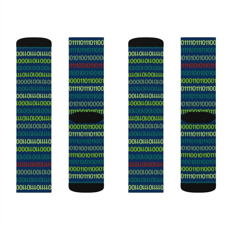 May include: Four pairs of blue socks with a repeating pattern of binary code in green, yellow, and red. The socks have black cuffs.