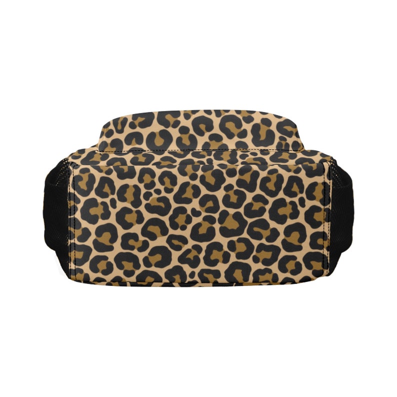 May include: A brown and black leopard print backpack with black straps.