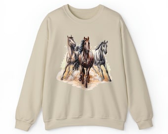 May include: Beige sweatshirt with a watercolor illustration of three horses running. The horses are brown, white, and gray.