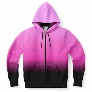 May include: A pink and black ombre zip-up hoodie with a hood.