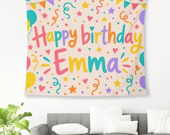 May include: A rectangular fabric wall tapestry featuring a light beige background with a colorful birthday theme. The text reads Happy birthday Emma in multi-colored letters, surrounded by illustrations of balloons, stars, hearts, and streamers.