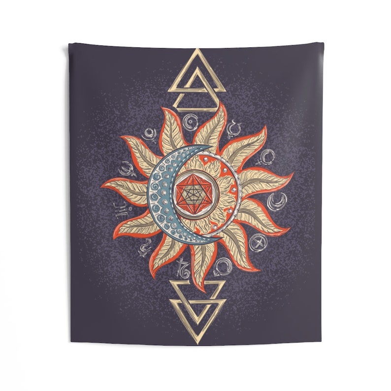 May include: A tapestry with a dark blue background featuring a stylized sun and moon design. The sun is orange and yellow with a red center and the moon is blue and white. The design is surrounded by a circle of gold triangles and other geometric shapes.
