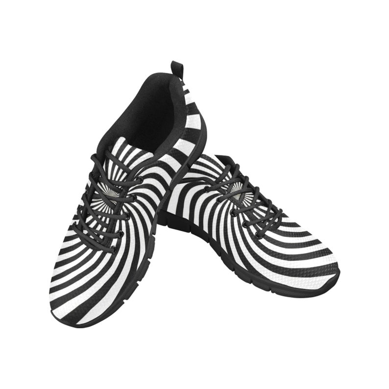 May include: A pair of black and white sneakers with a swirling, hypnotic pattern. The shoes have a black sole and white laces.
