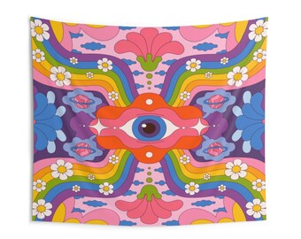 May include: A psychedelic tapestry featuring a large eye at its centre, surrounded by rainbows, flowers, and planets. The background is pink with purple and blue accents.